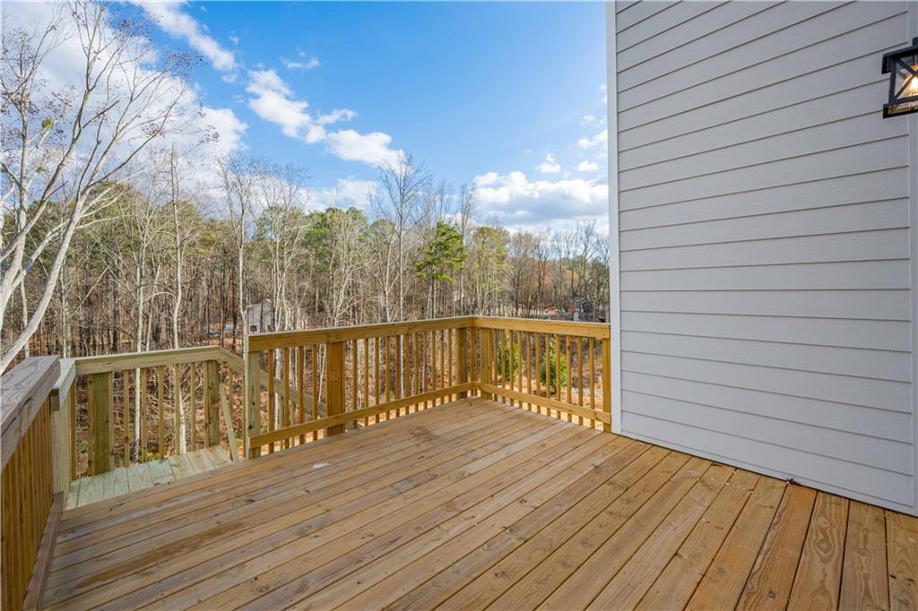 126 Spaulding Lane Woodstock, GA 30188 - Photo 42 of 48 a view of balcony with wooden floor