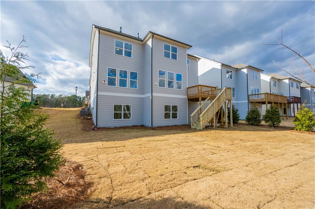 126 Spaulding Lane Woodstock, GA 30188 - Photo 45 of 48 a front view of a house with a yard