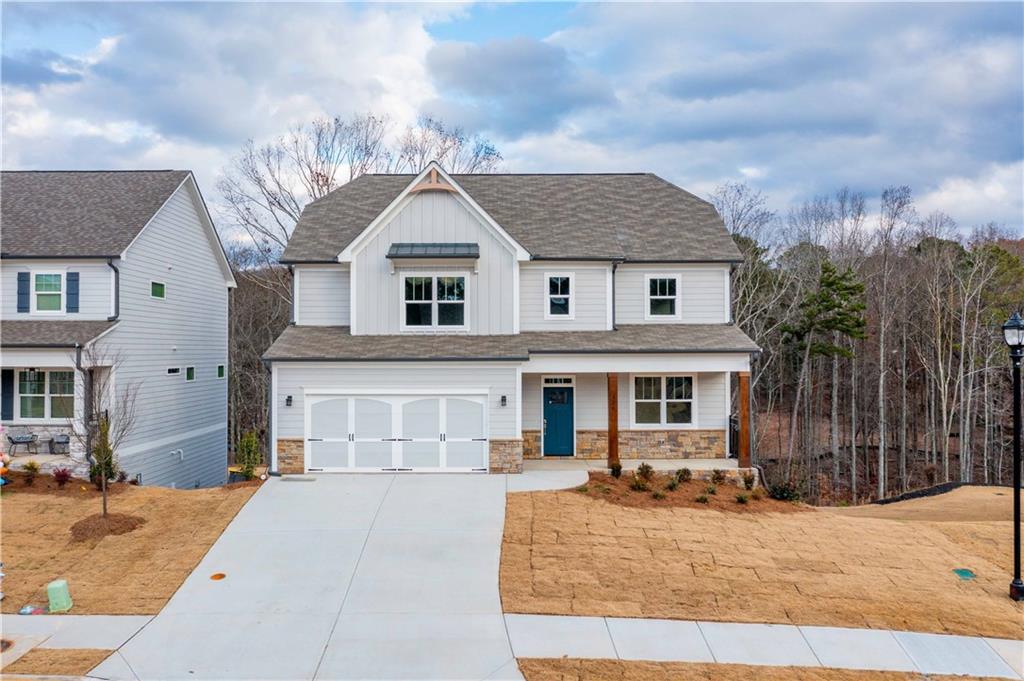 126 Spaulding Lane Woodstock, GA 30188 - Photo 46 of 48 a front view of a house with garden