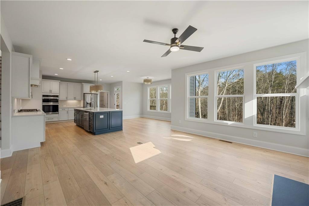 126 Spaulding Lane Woodstock, GA 30188 - Photo 9 of 48 a view of kitchen with furniture and a window