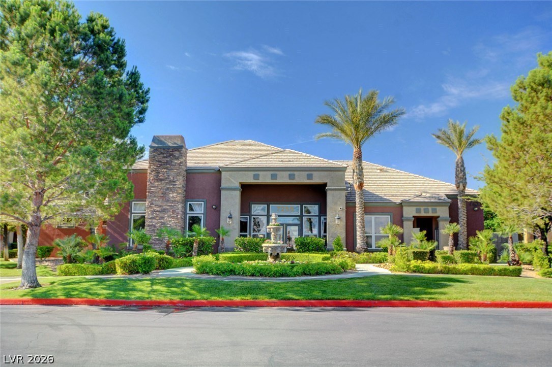 7255 West Sunset Road, Unit 2078 Las Vegas, NV 89113 - Photo 25 of 34 An inviting entry fountain complements the manicured landscaping and mature trees of this distinguished facade.