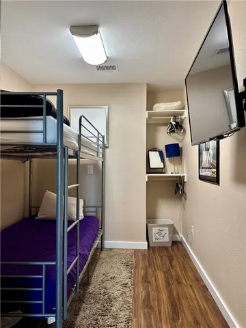 a view of hallway with a large mirror and a window