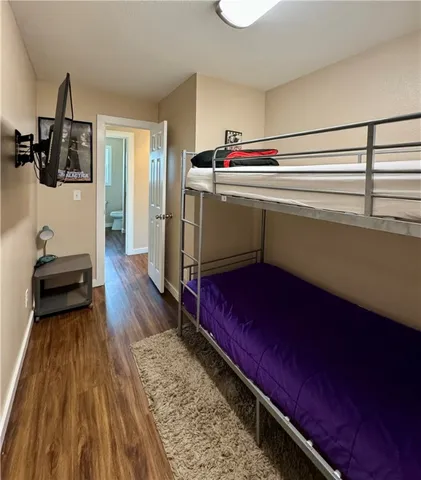 a room with wooden floor and furniture