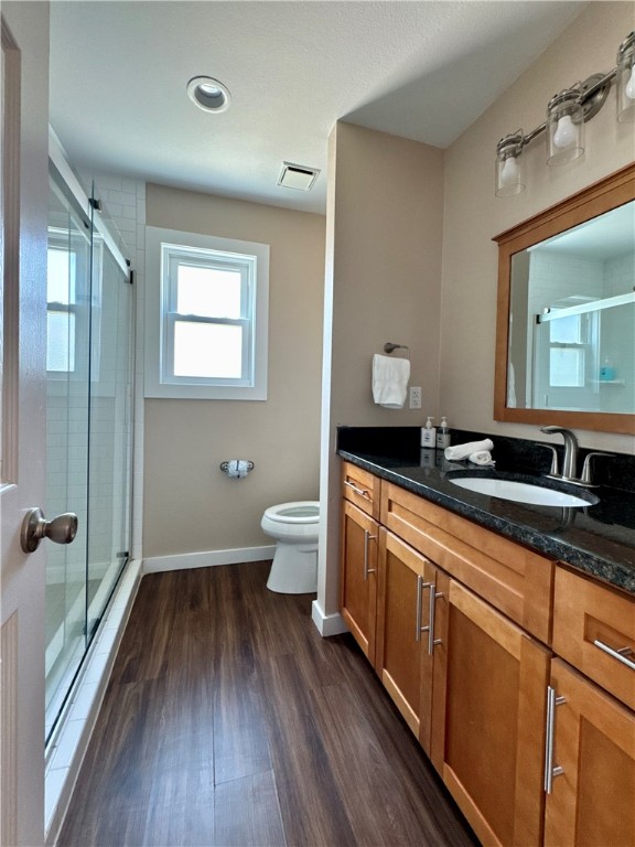 230 Cut-Off Road, Unit B107 Port Aransas, TX 78373 - Photo 15 of 25 a spacious bathroom with a granite countertop sink toilet a mirror and shower