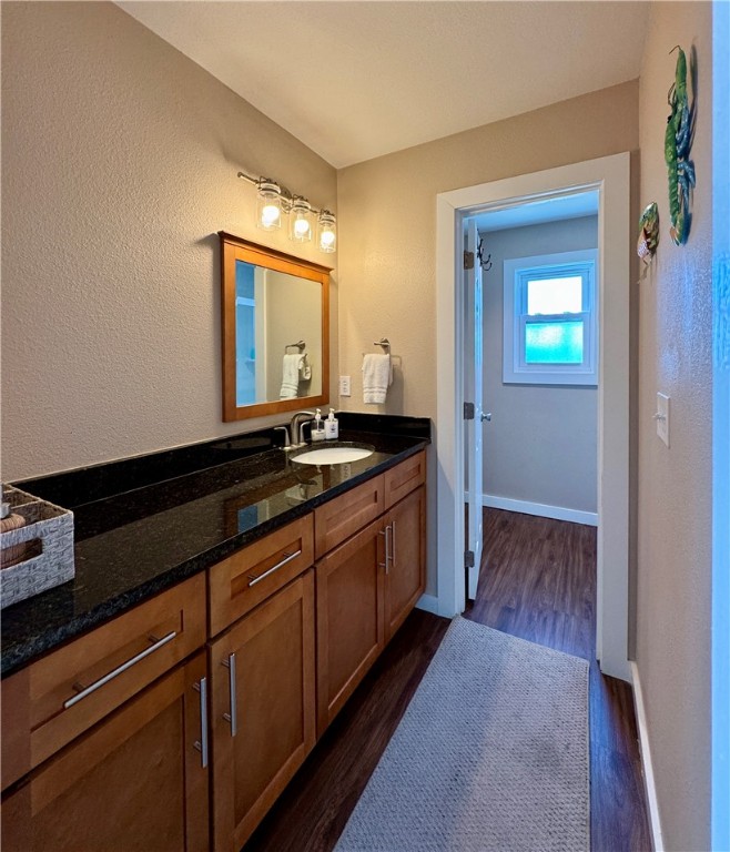 230 Cut-Off Road, Unit B107 Port Aransas, TX 78373 - Photo 20 of 25 a kitchen with sink and cabinets