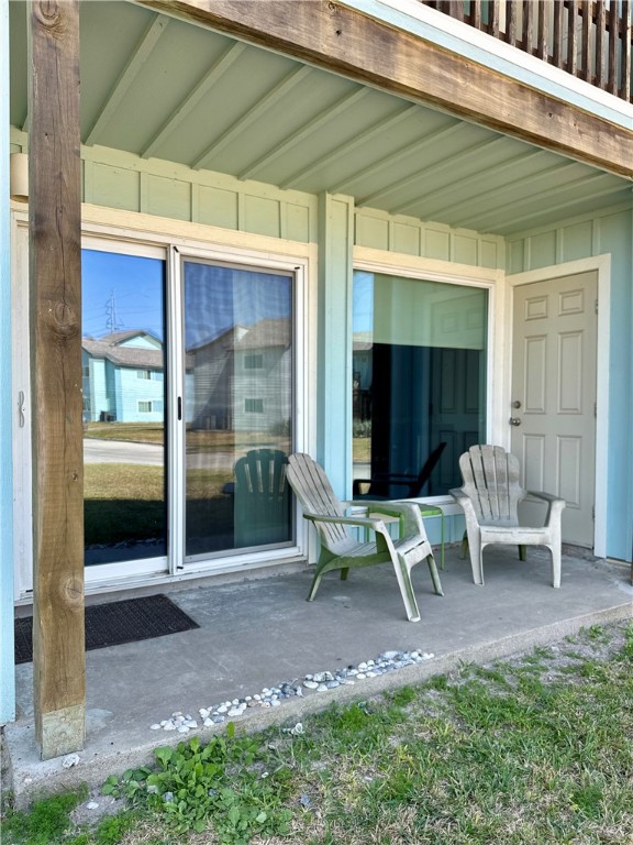 230 Cut-Off Road, Unit B107 Port Aransas, TX 78373 - Photo 22 of 25 a view of a two chairs in the patio