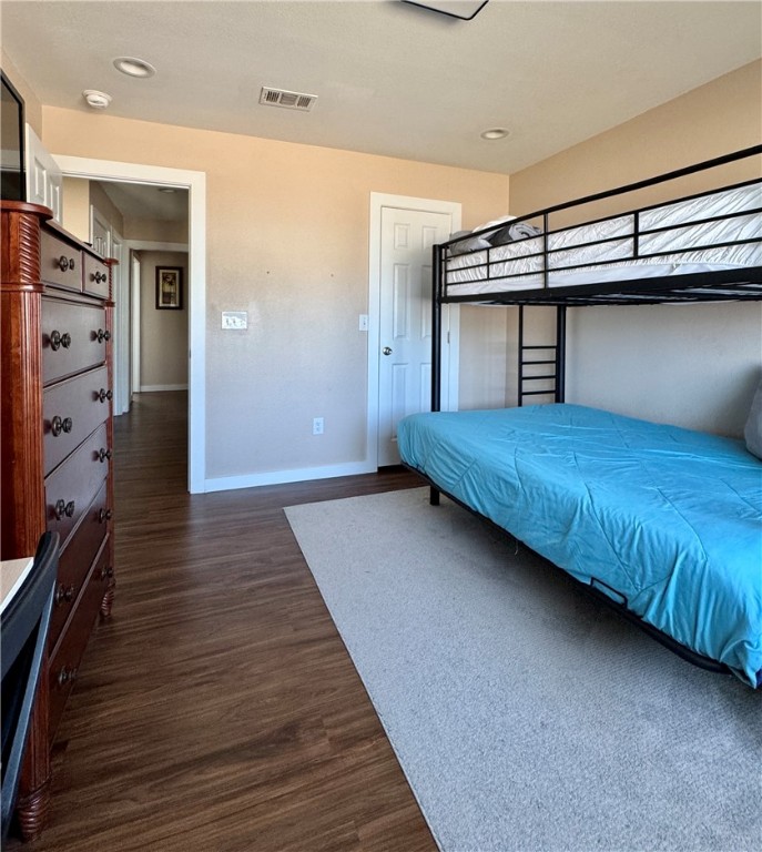 230 Cut-Off Road, Unit B107 Port Aransas, TX 78373 - Photo 9 of 25 a bedroom with a bed and a walk in closet