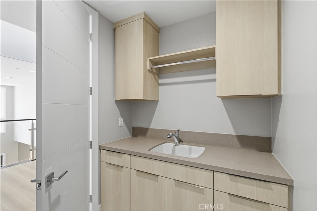 156 Apron Irvine, CA 92618 - Photo 37 of 40 a kitchen with a sink and cabinets