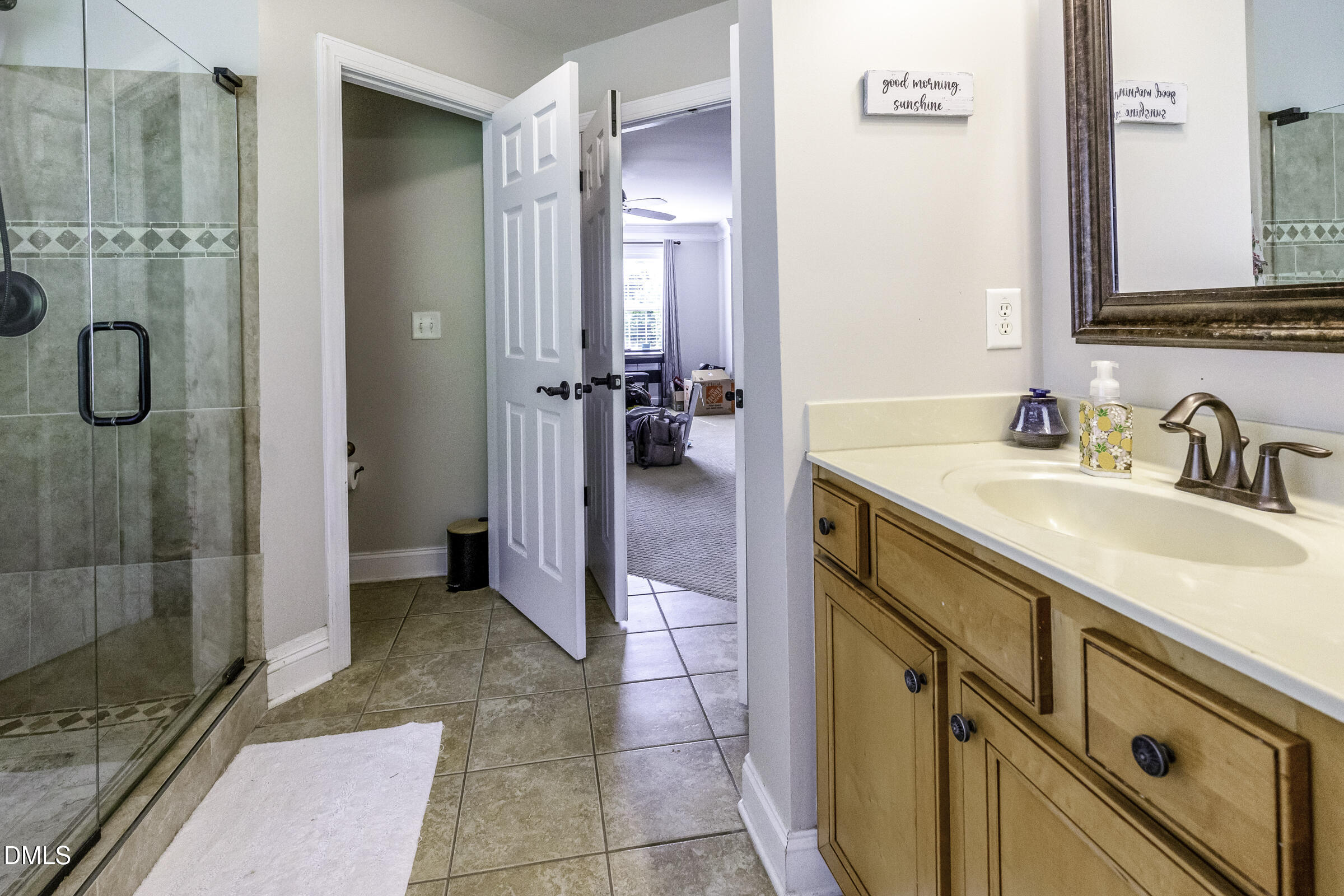 201 Quarryrock Road Holly Springs, NC 27540 - Photo 29 of 34 a bathroom with a sink and a mirror