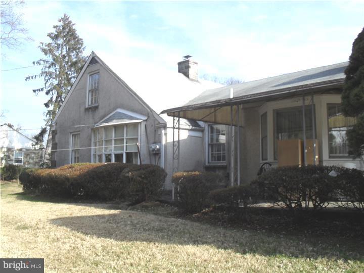 22 Beryl Road Cheltenham, PA 19012 - Photo 5 of 14 a front view of a house with a yard