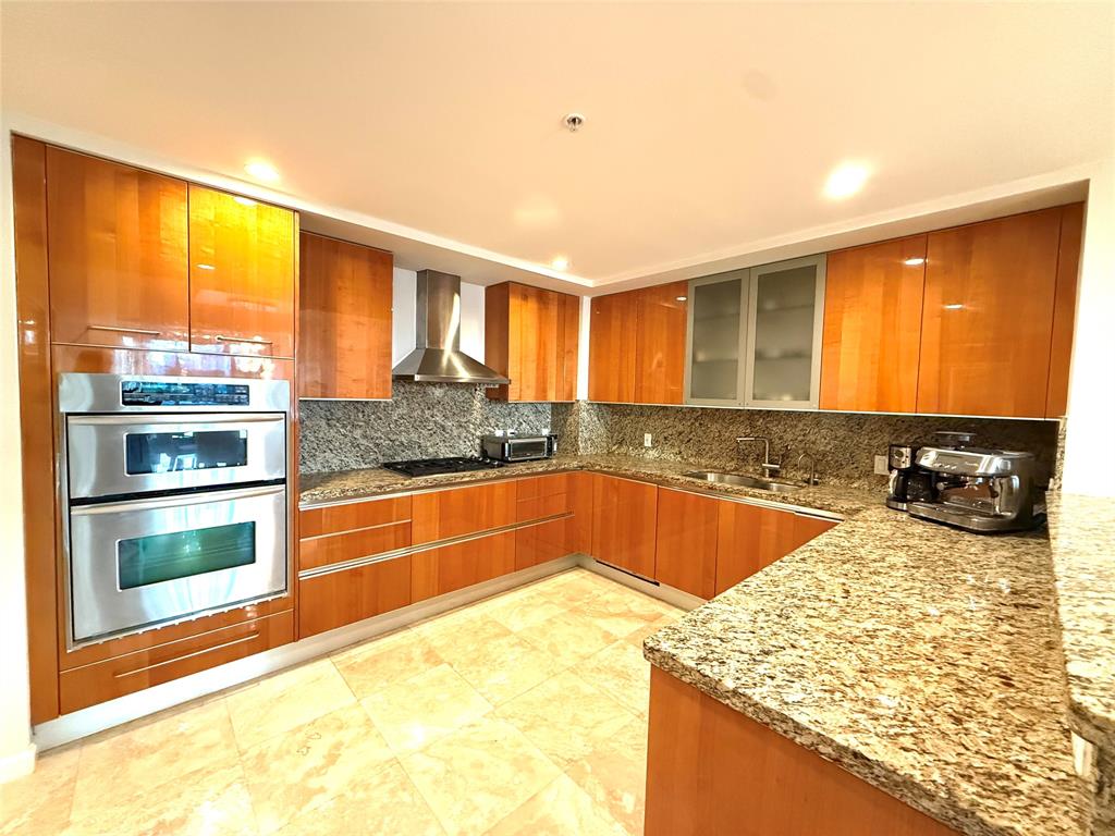 45 Hendricks Isle, Unit 403 Fort Lauderdale, FL 33301 - Photo 6 of 26 a kitchen with stainless steel appliances granite countertop a sink and a large window
