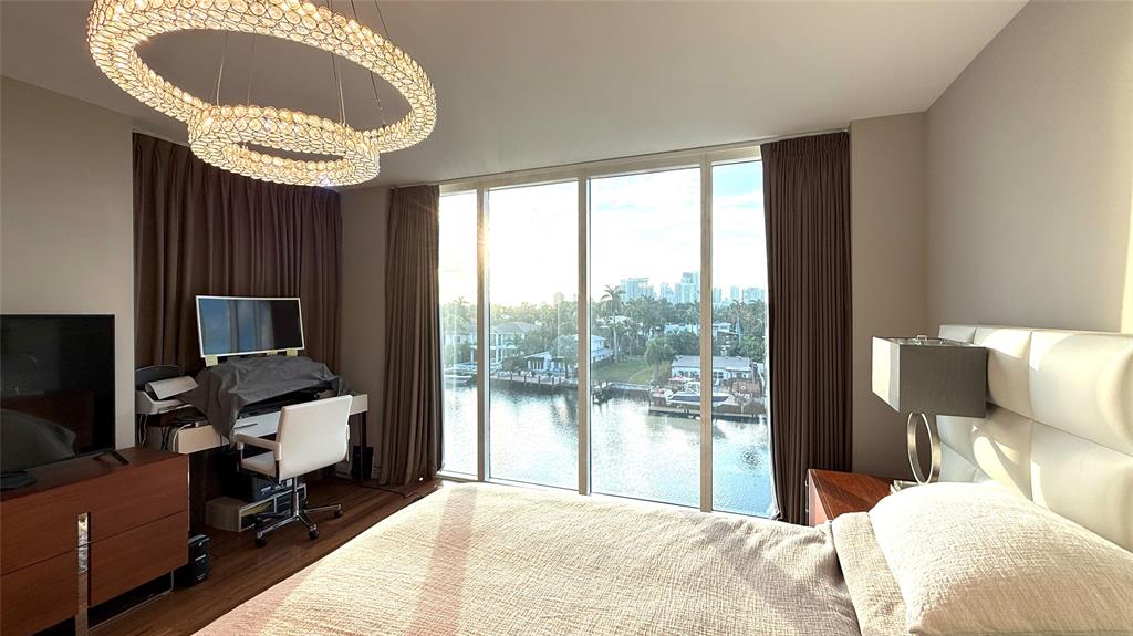 45 Hendricks Isle, Unit 403 Fort Lauderdale, FL 33301 - Photo 8 of 26 a bedroom with a large bed and a large window