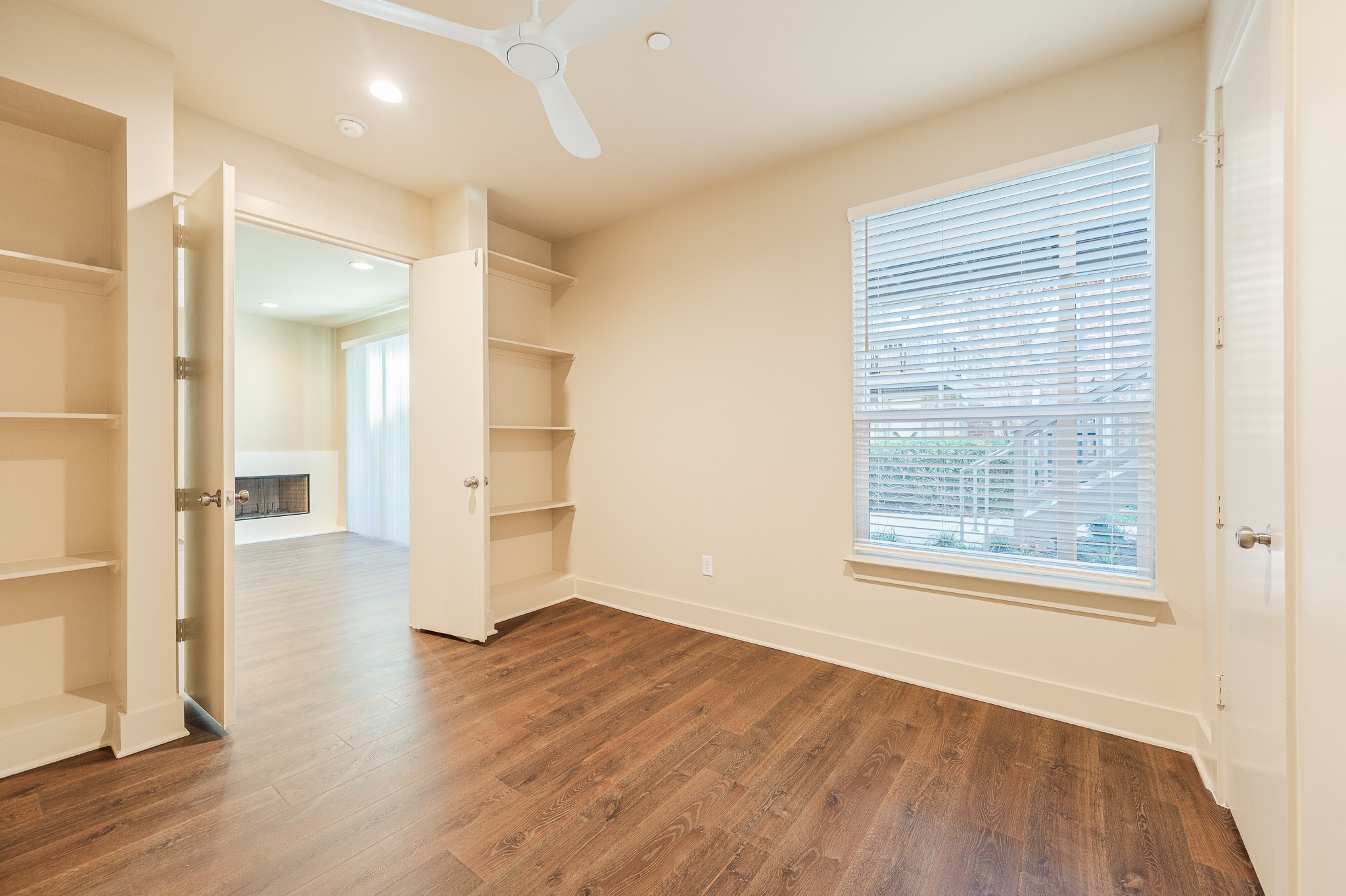 2829 Timmons Lane, Unit 201 Houston, TX 77027 - Photo 11 of 42 wooden floor in an empty room with a window