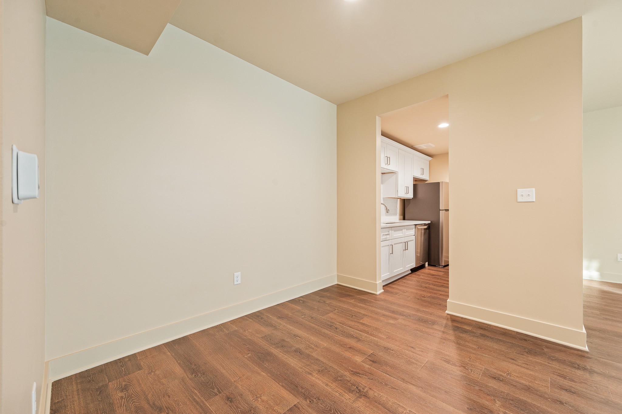 2829 Timmons Lane, Unit 201 Houston, TX 77027 - Photo 15 of 42 a view of a kitchen with a sink and wooden floor