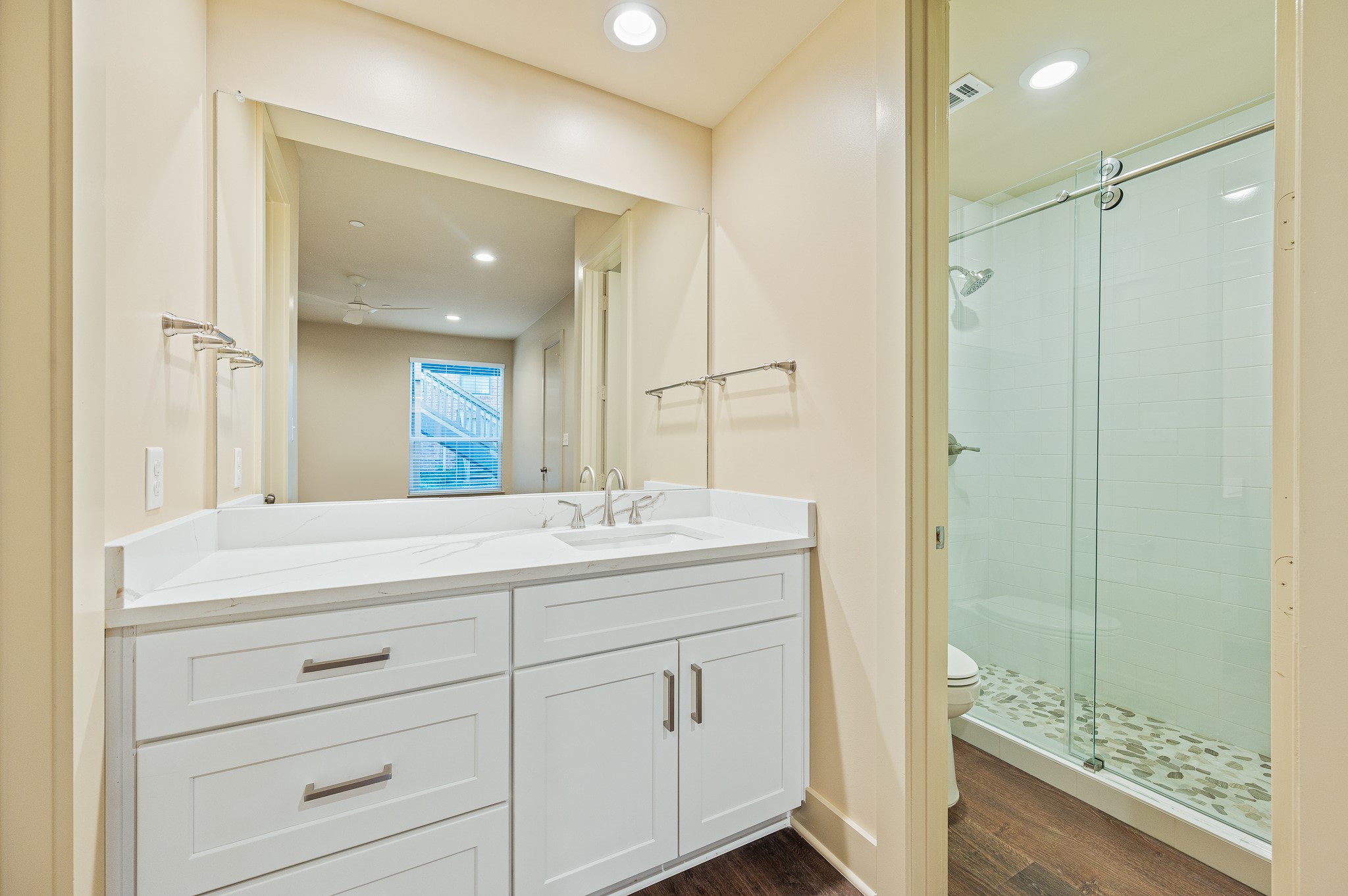 2829 Timmons Lane, Unit 201 Houston, TX 77027 - Photo 22 of 42 a bathroom with a shower sink and mirror