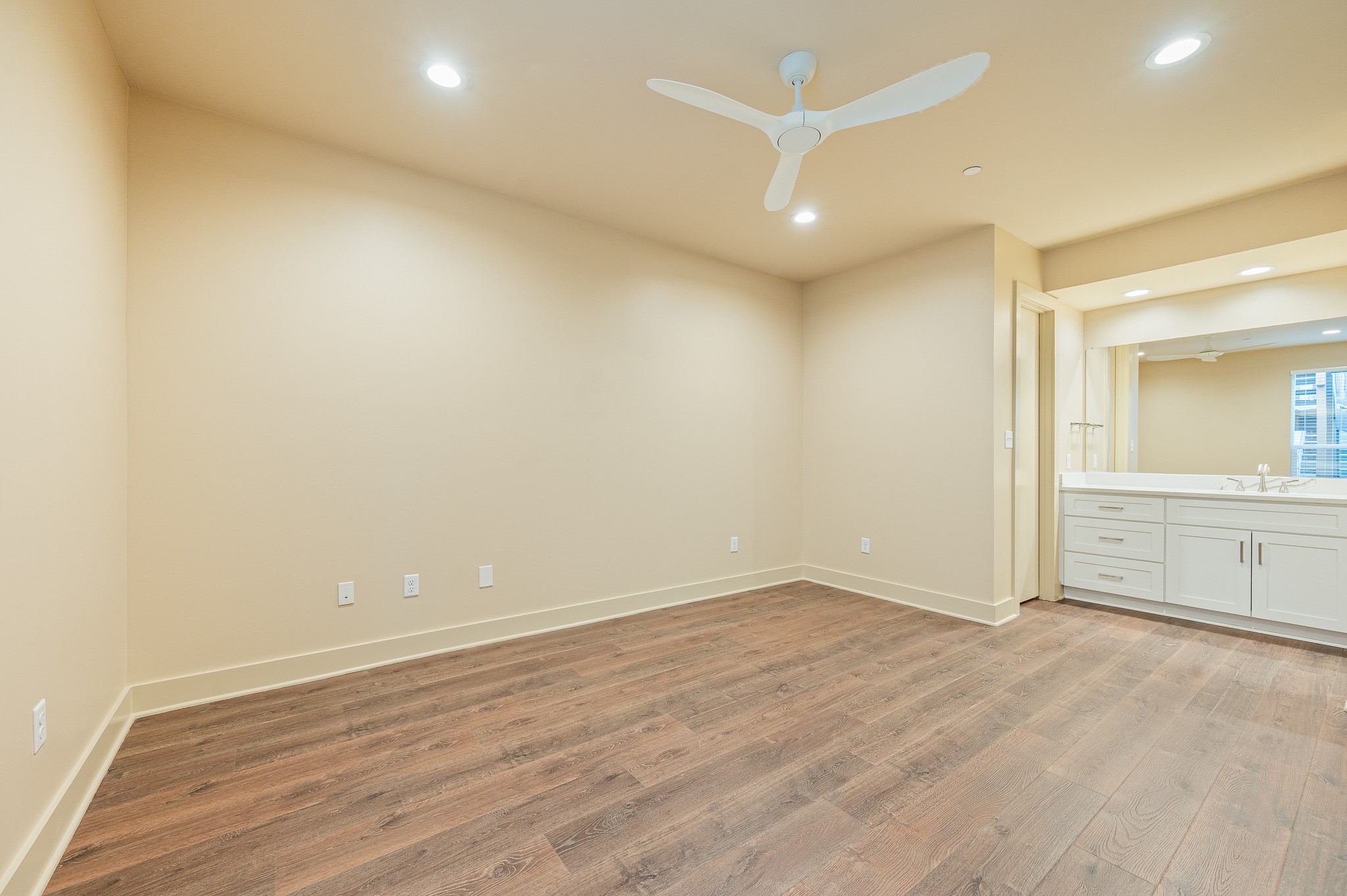 2829 Timmons Lane, Unit 201 Houston, TX 77027 - Photo 26 of 42 an empty room with wooden floor and windows
