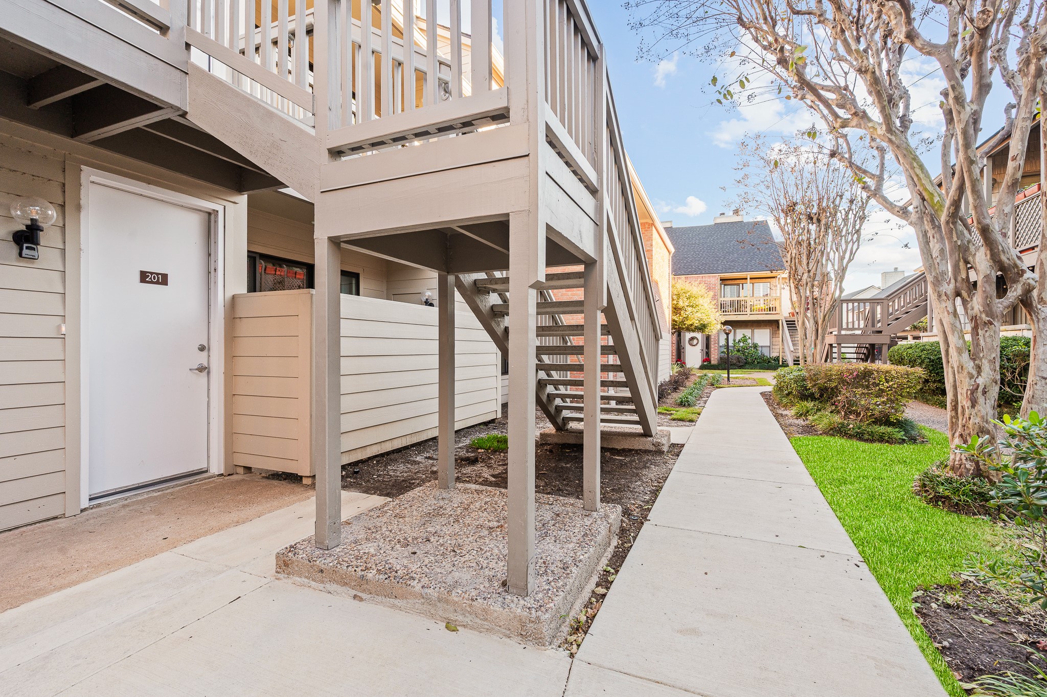 2829 Timmons Lane, Unit 201 Houston, TX 77027 - Photo 3 of 42 a view of a entrance with a house