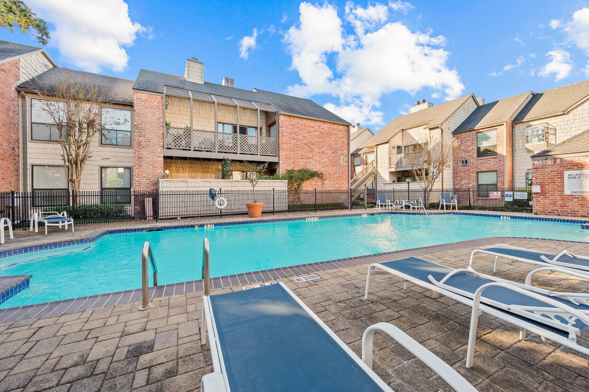 2829 Timmons Lane, Unit 201 Houston, TX 77027 - Photo 37 of 42 a view of a swimming pool with a patio