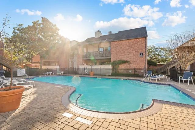 a view of a swimming pool with lounge chair