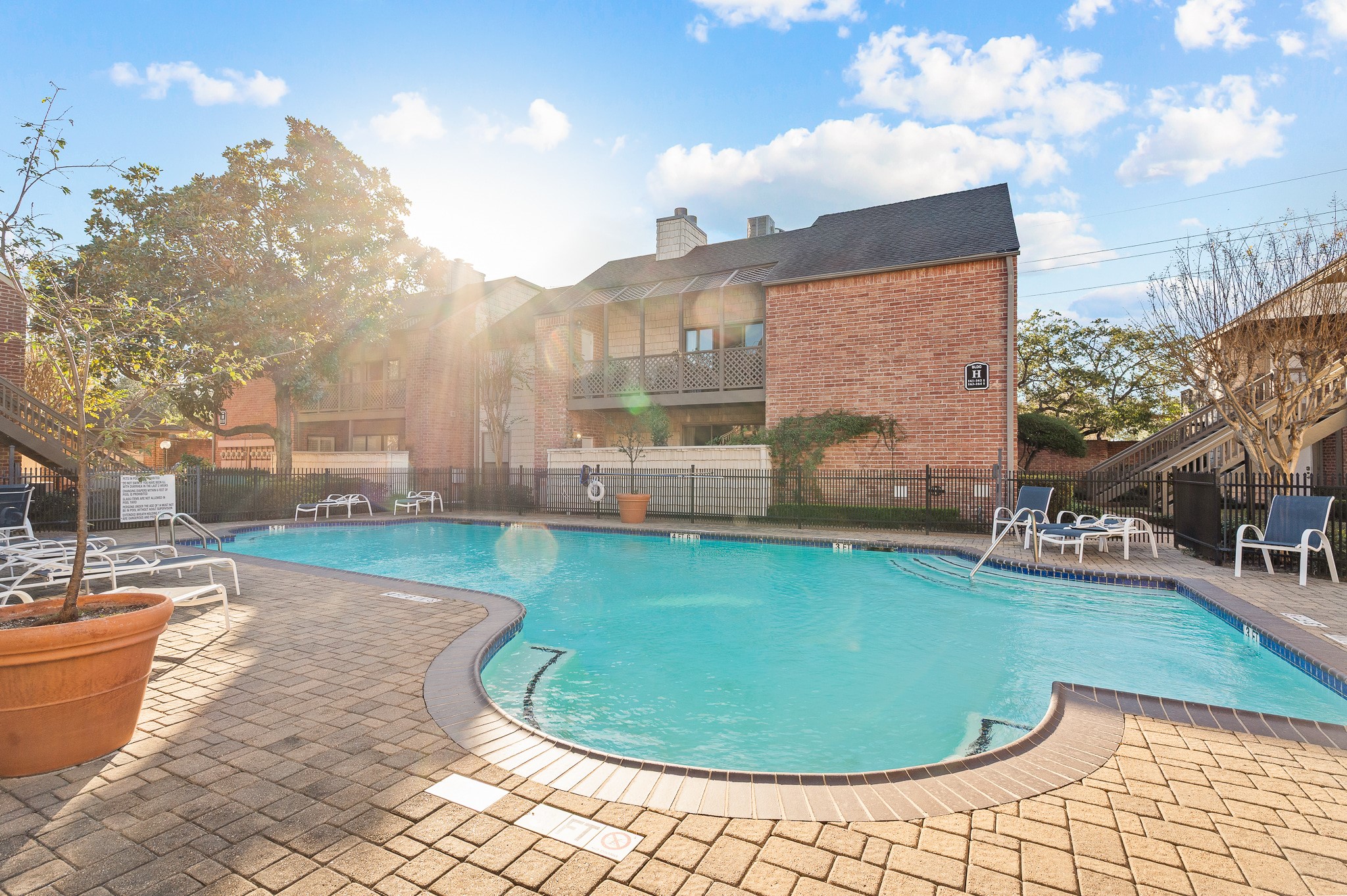 2829 Timmons Lane, Unit 201 Houston, TX 77027 - Photo 38 of 42 a view of a swimming pool in a backyard