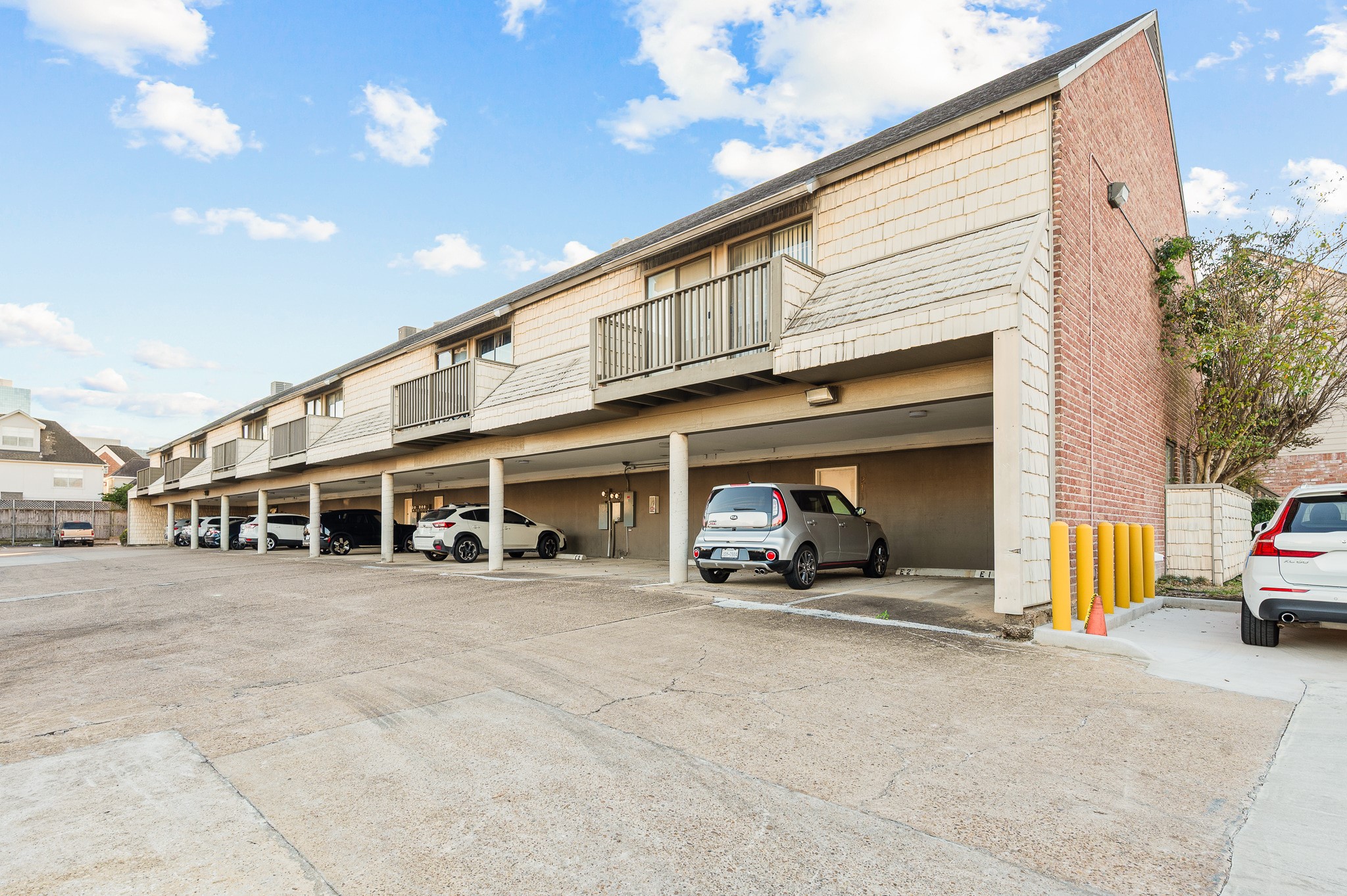 2829 Timmons Lane, Unit 201 Houston, TX 77027 - Photo 40 of 42 a view of a building with car parked