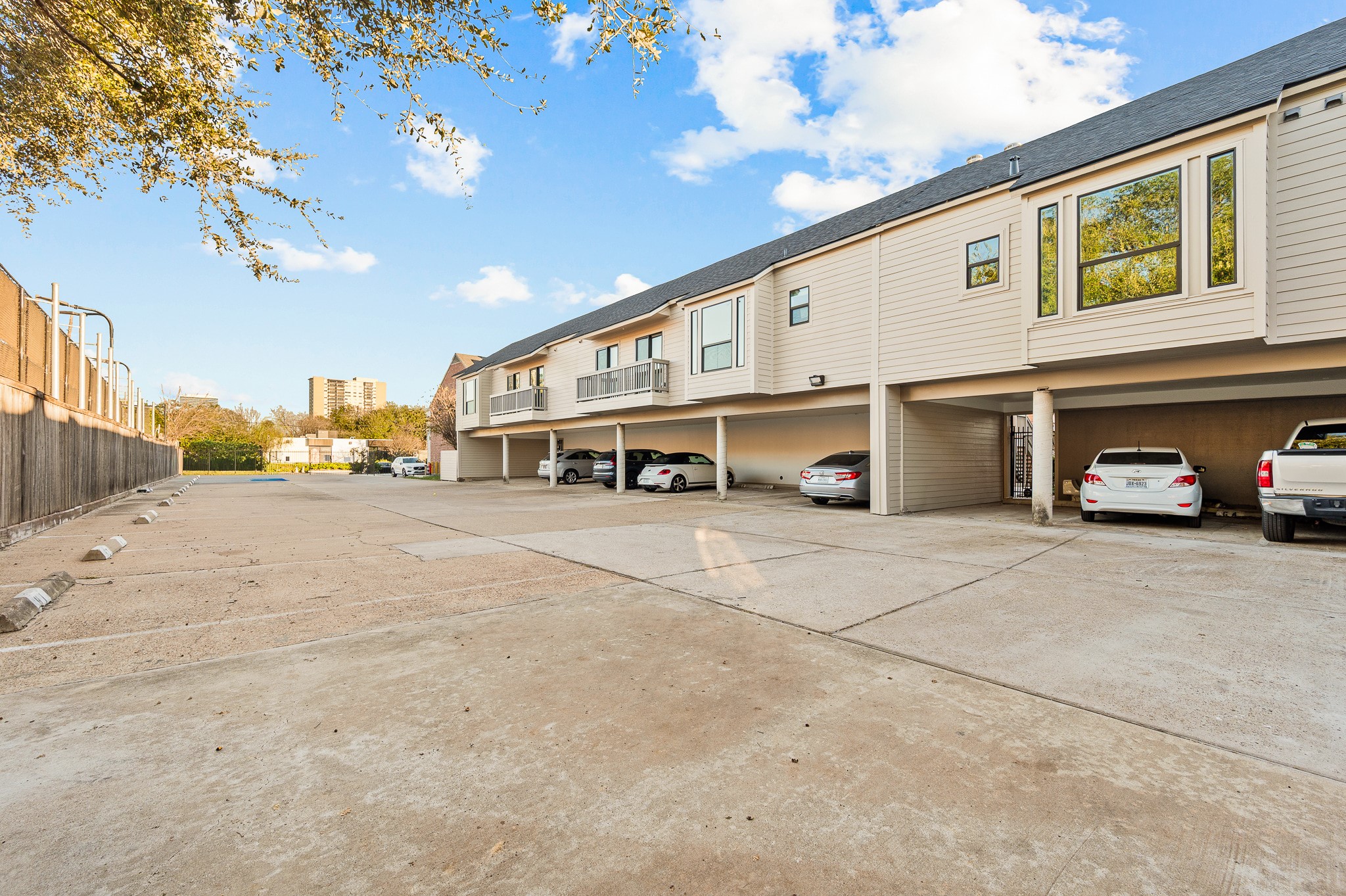 2829 Timmons Lane, Unit 201 Houston, TX 77027 - Photo 42 of 42 a couple of cars parked in front of a building