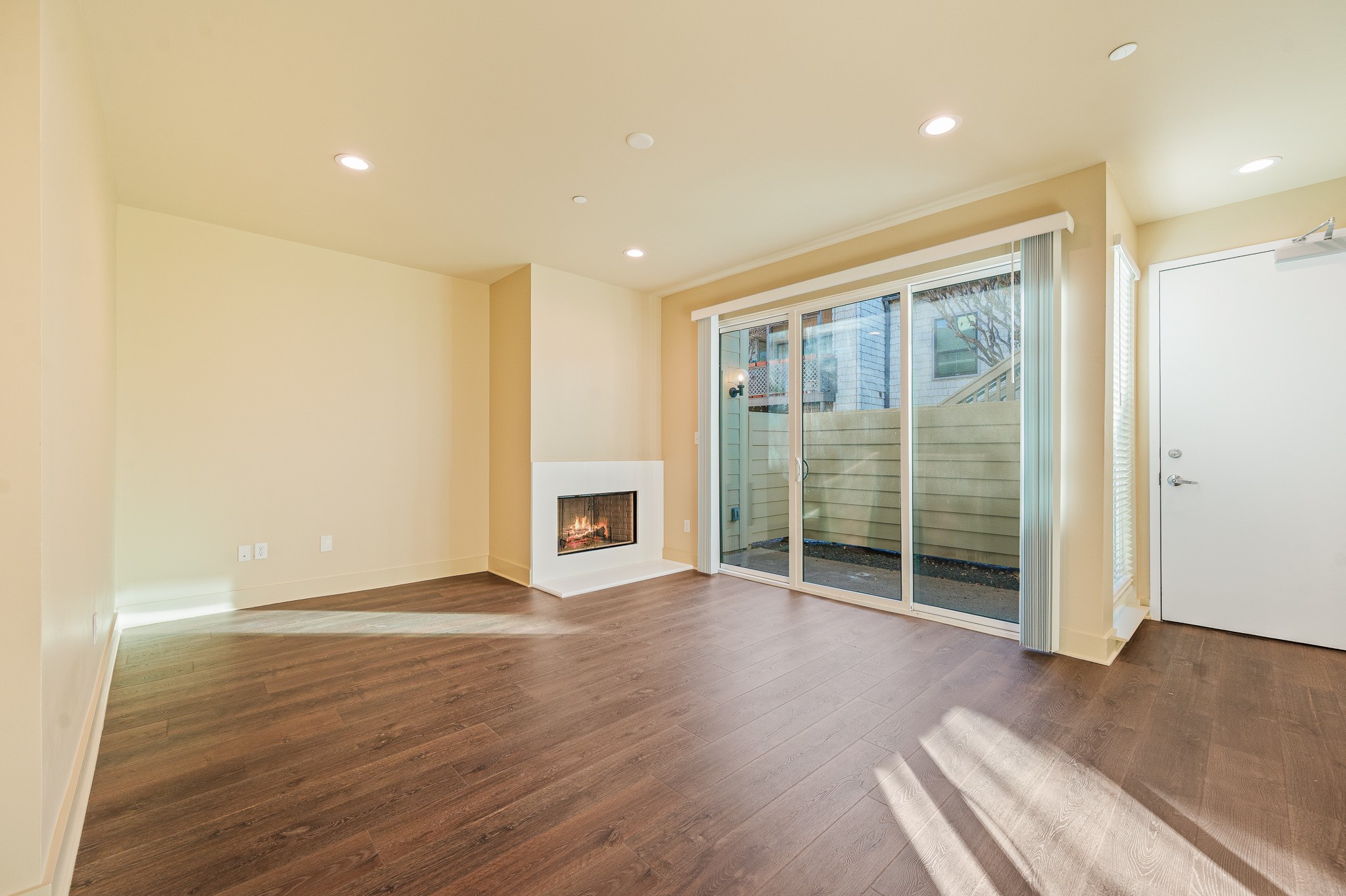 2829 Timmons Lane, Unit 201 Houston, TX 77027 - Photo 7 of 42 a view of an empty room with wooden floor and a window