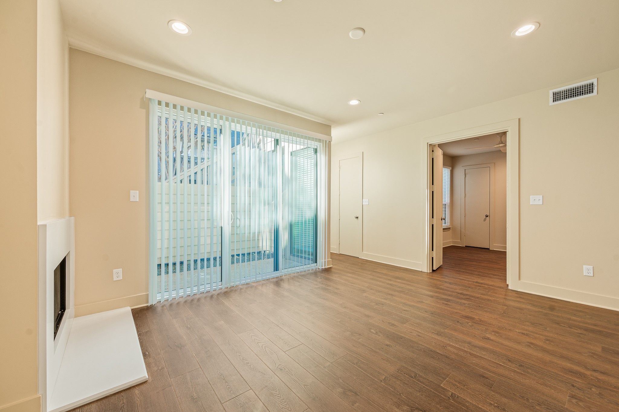 2829 Timmons Lane, Unit 201 Houston, TX 77027 - Photo 8 of 42 an empty room with wooden floor and windows