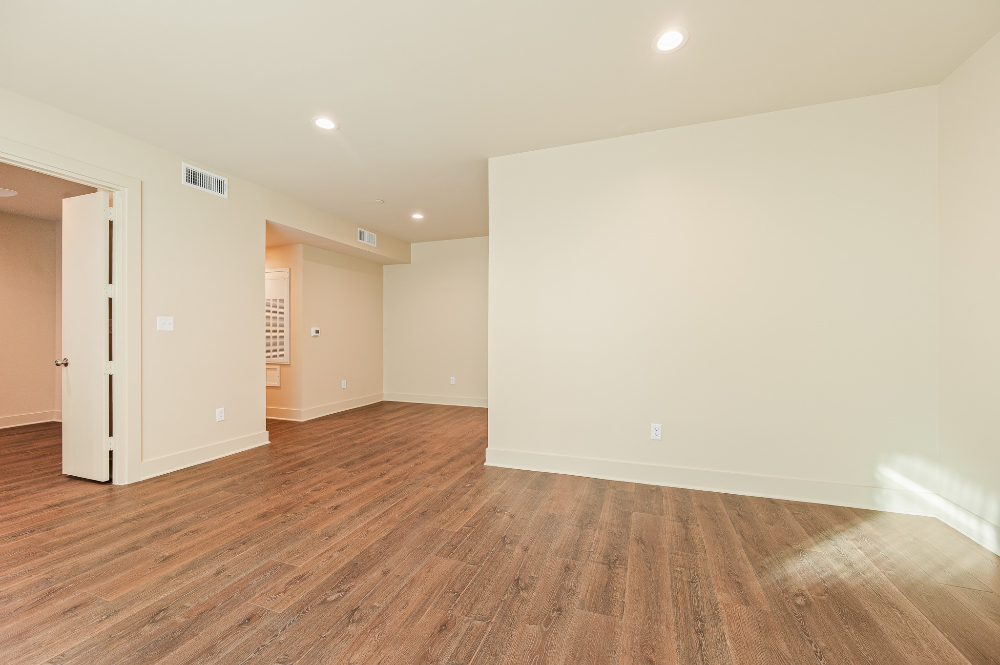 2829 Timmons Lane, Unit 201 Houston, TX 77027 - Photo 9 of 42 a view of an empty room with wooden floor and closet
