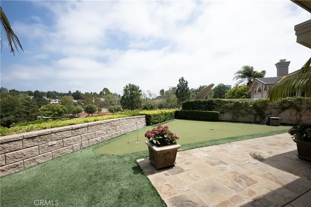 a view of a garden and swimming pool
