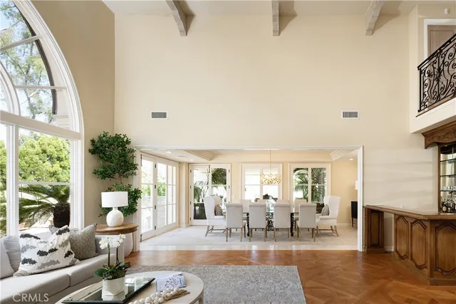 a living room with fireplace furniture and a large window