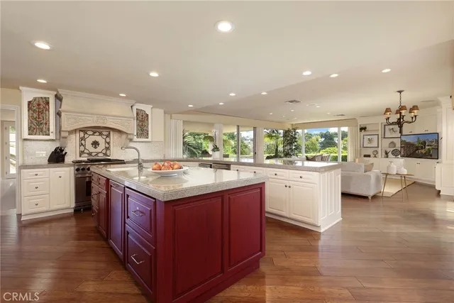 a kitchen with granite countertop a sink and cabinets