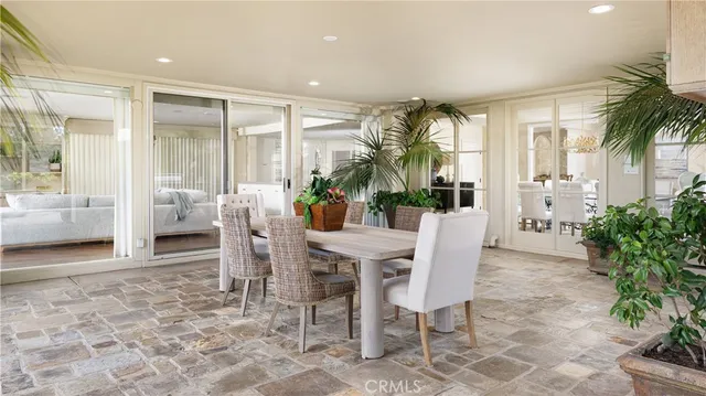 a dining room with furniture and window in it