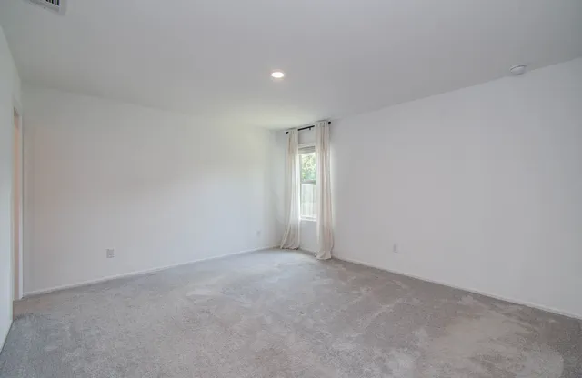 a view of an empty room and window