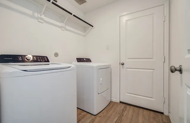 a utility room with dryer and washer