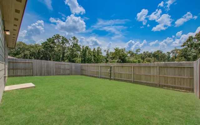 a view of a backyard with a swing and stairs