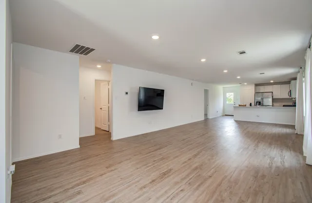 a view of kitchen with wooden floor and a kitchen