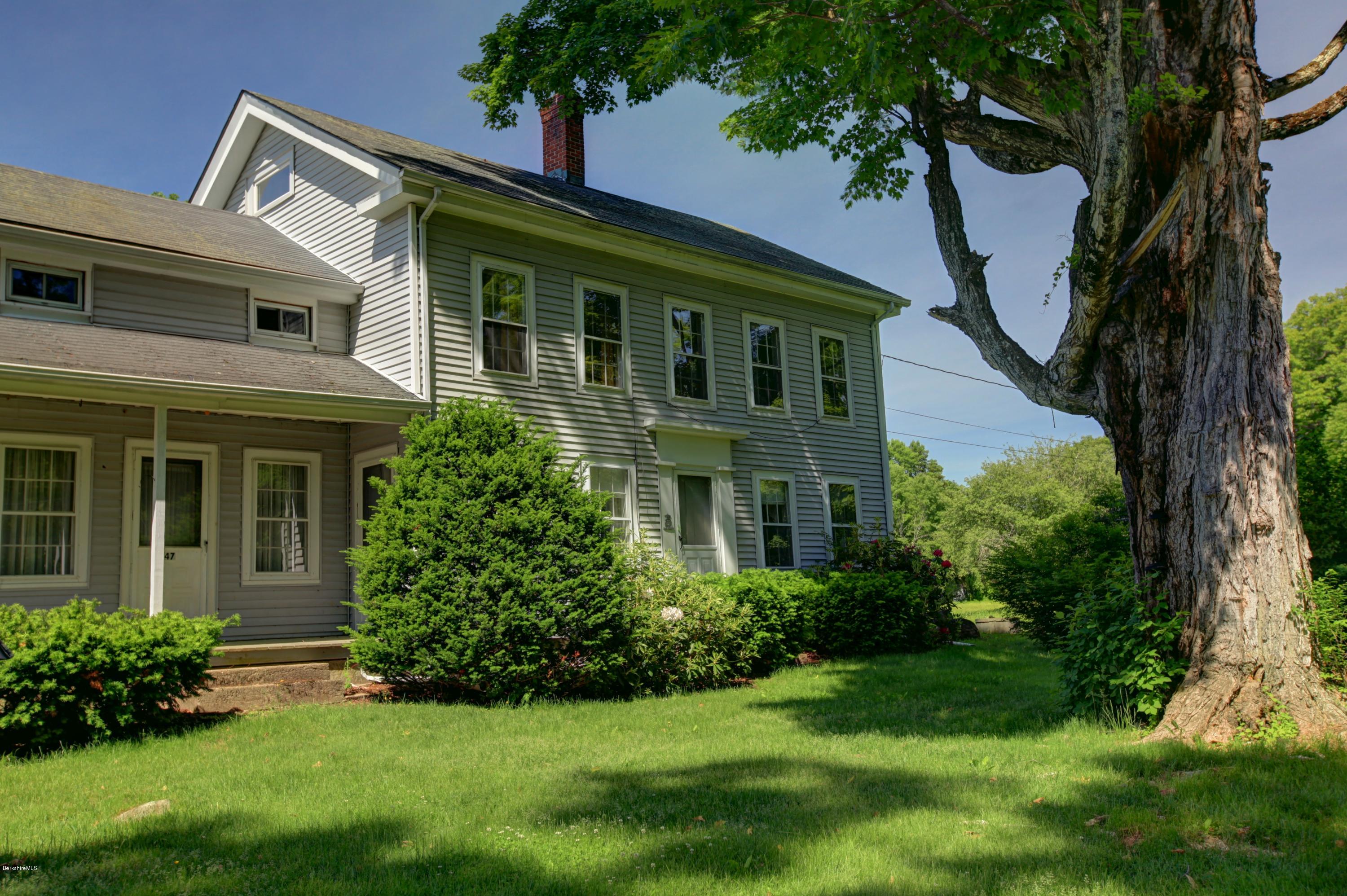 47 Sandisfield Road Sandisfield, MA 01255 - Photo 3 of 25 a front view of a house with a garden