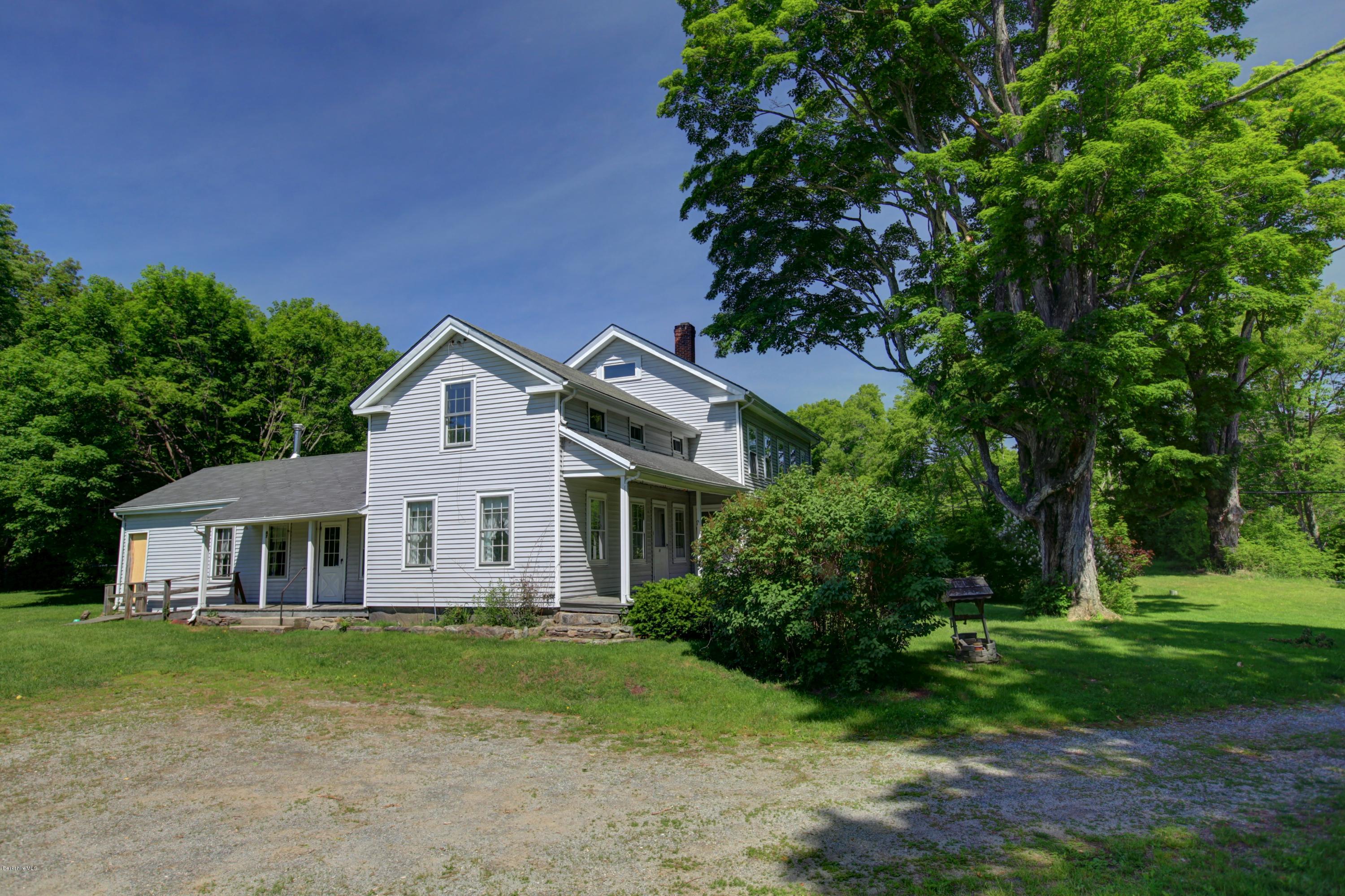 47 Sandisfield Road Sandisfield, MA 01255 - Photo 4 of 25 a front view of a house with a garden