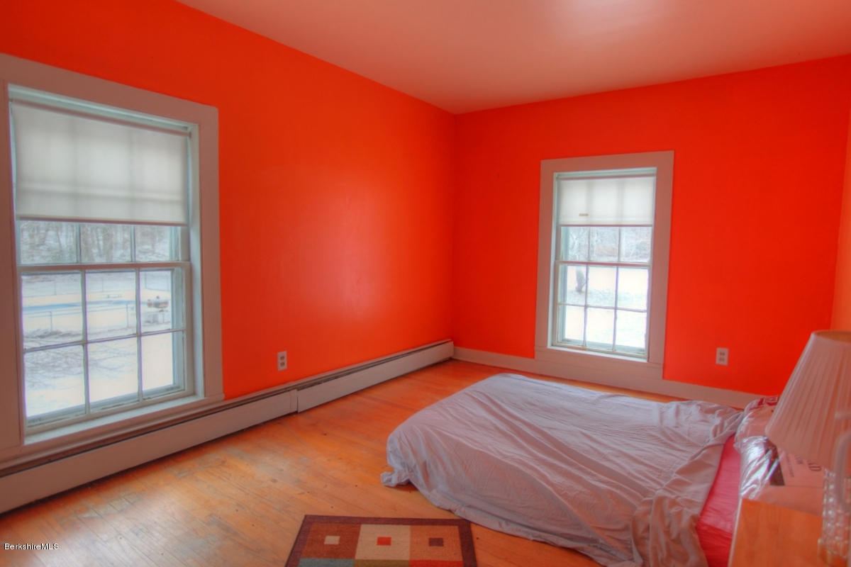 47 Sandisfield Road Sandisfield, MA 01255 - Photo 9 of 25 a bed room with a bed and a window