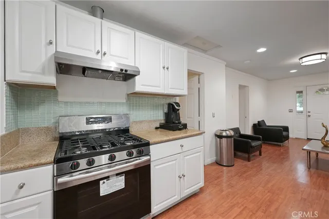 a living room with a couch and a dresser