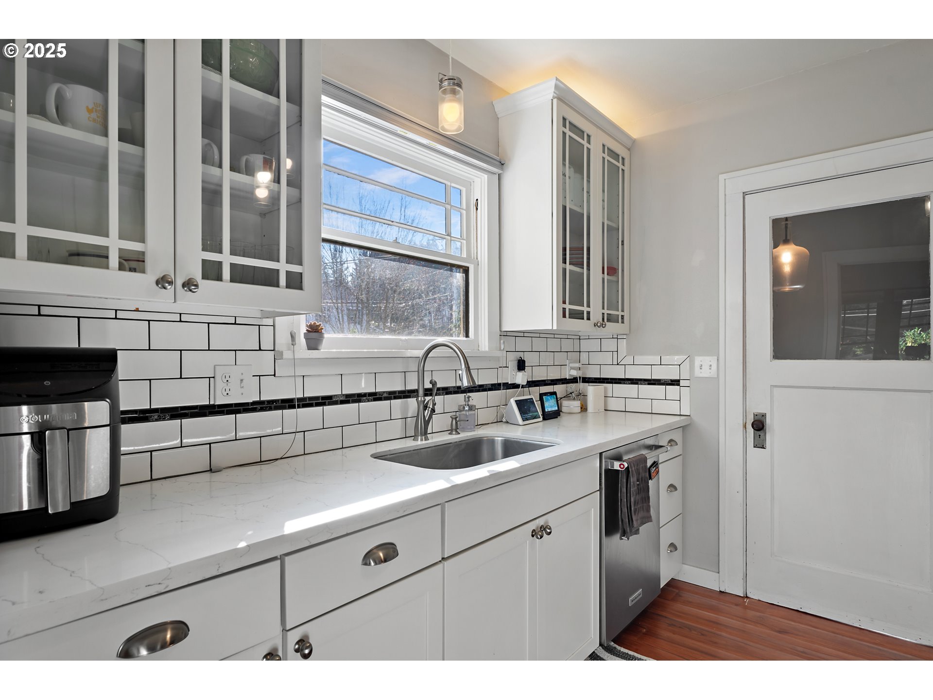 9670 Southwest Frewing Street Portland, OR 97223 - Photo 15 of 40 a view of a kitchen with a sink and cabinets