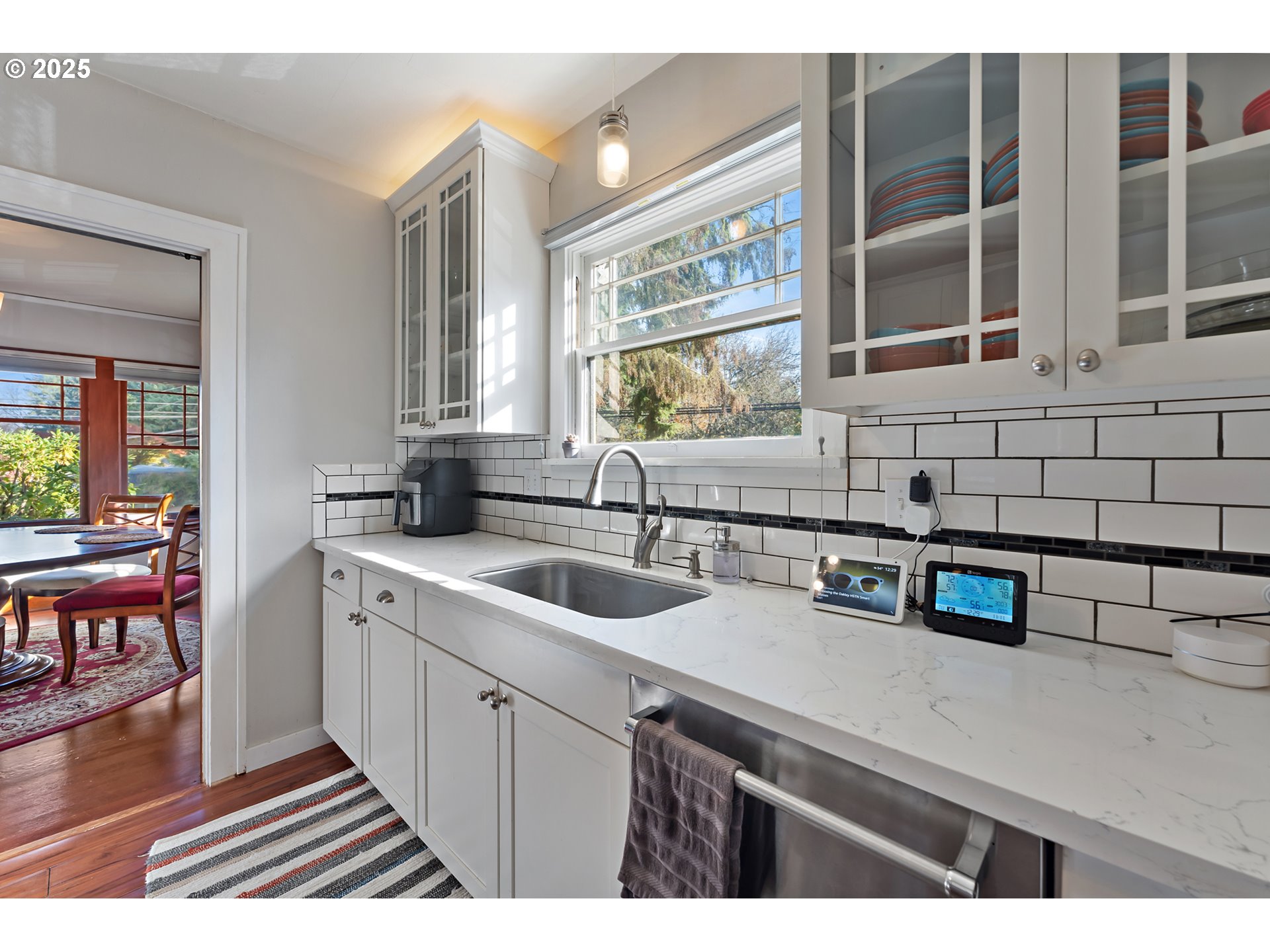 9670 Southwest Frewing Street Portland, OR 97223 - Photo 16 of 40 a kitchen that has a sink and a stove
