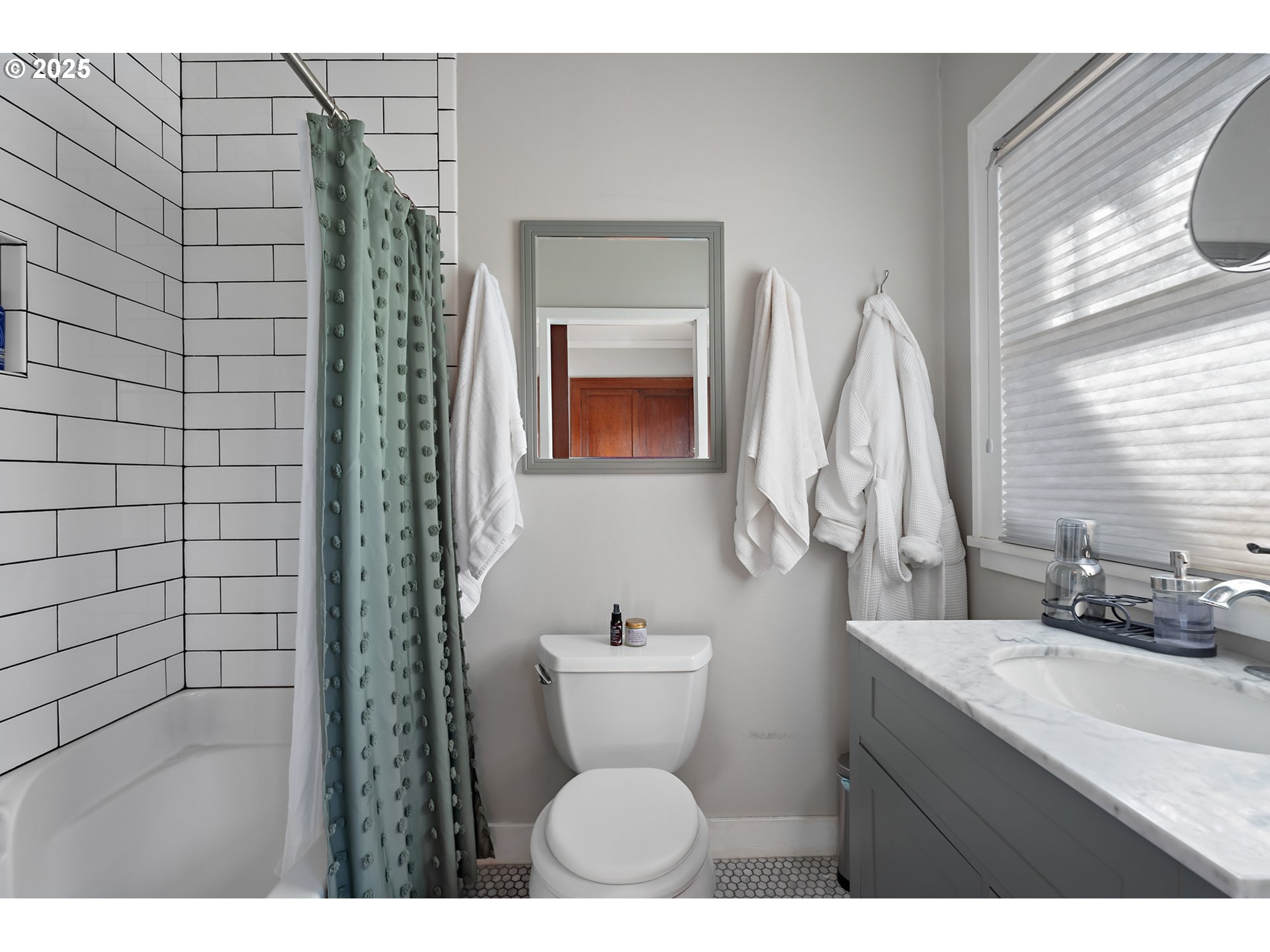 9670 Southwest Frewing Street Portland, OR 97223 - Photo 19 of 40 a bathroom with a sink and a mirror