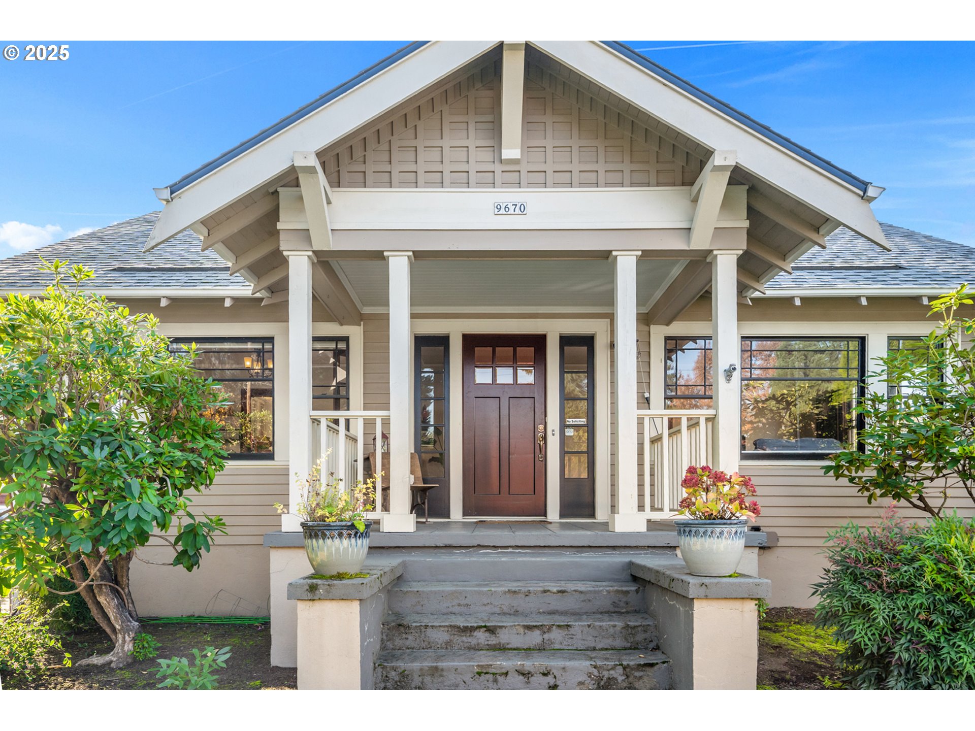 9670 Southwest Frewing Street Portland, OR 97223 - Photo 2 of 40 a front view of a house with a yard