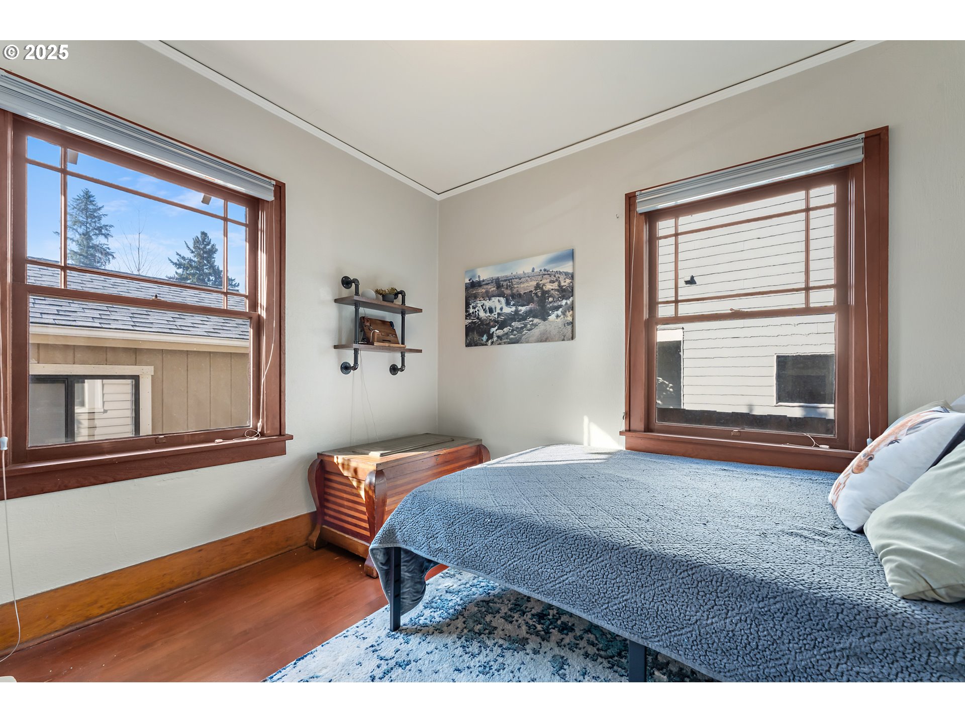 9670 Southwest Frewing Street Portland, OR 97223 - Photo 22 of 40 a bedroom with a bed and a window