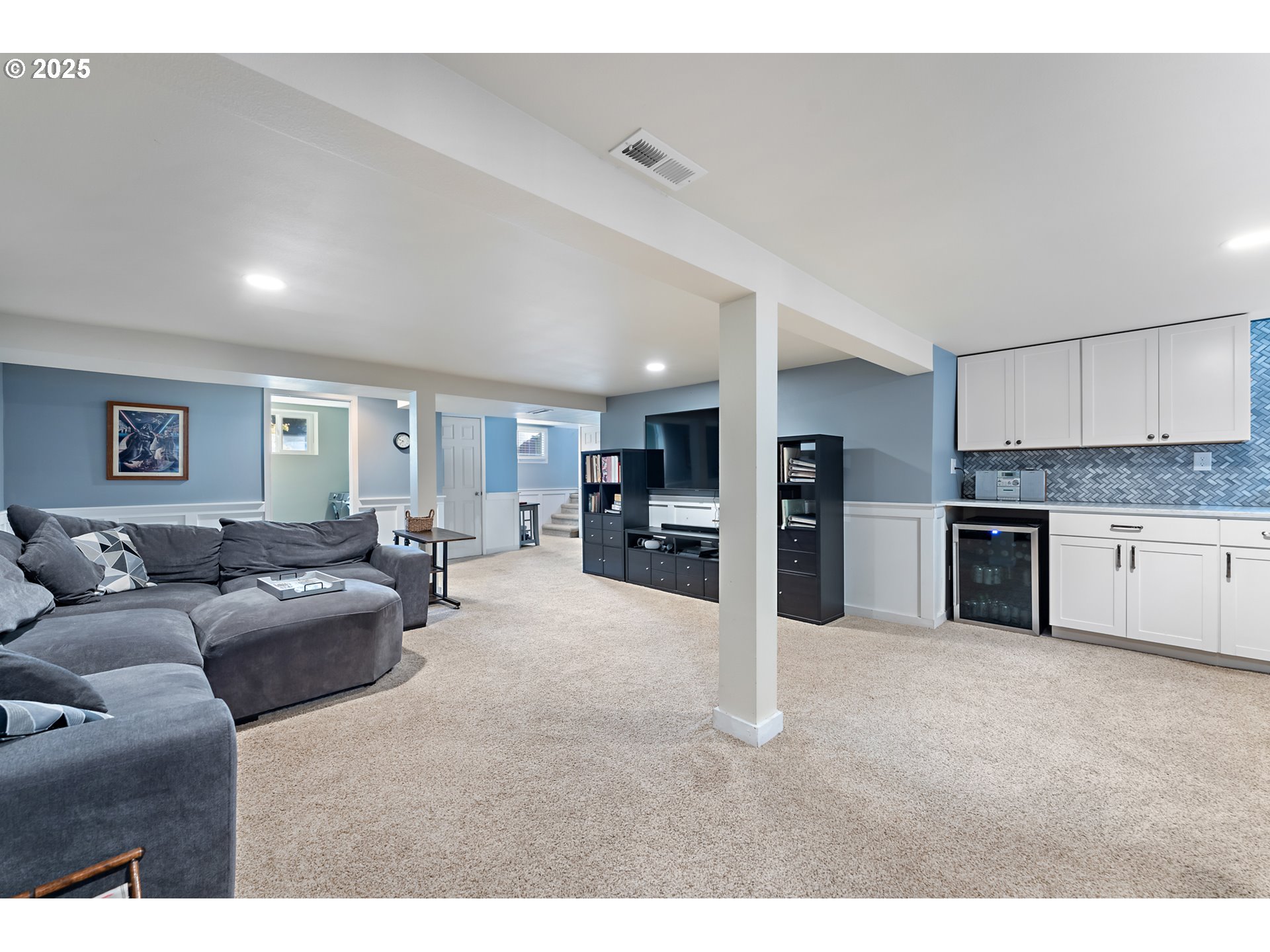 9670 Southwest Frewing Street Portland, OR 97223 - Photo 23 of 40 a living room with furniture and a kitchen