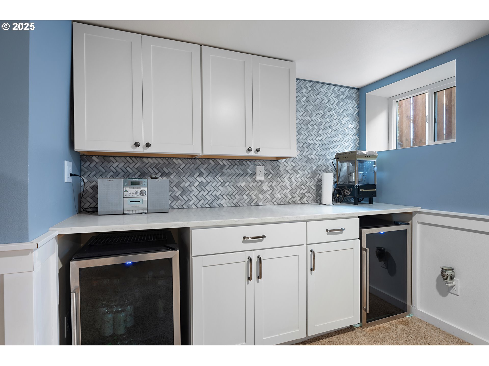 9670 Southwest Frewing Street Portland, OR 97223 - Photo 25 of 40 a kitchen with white cabinets and white appliances