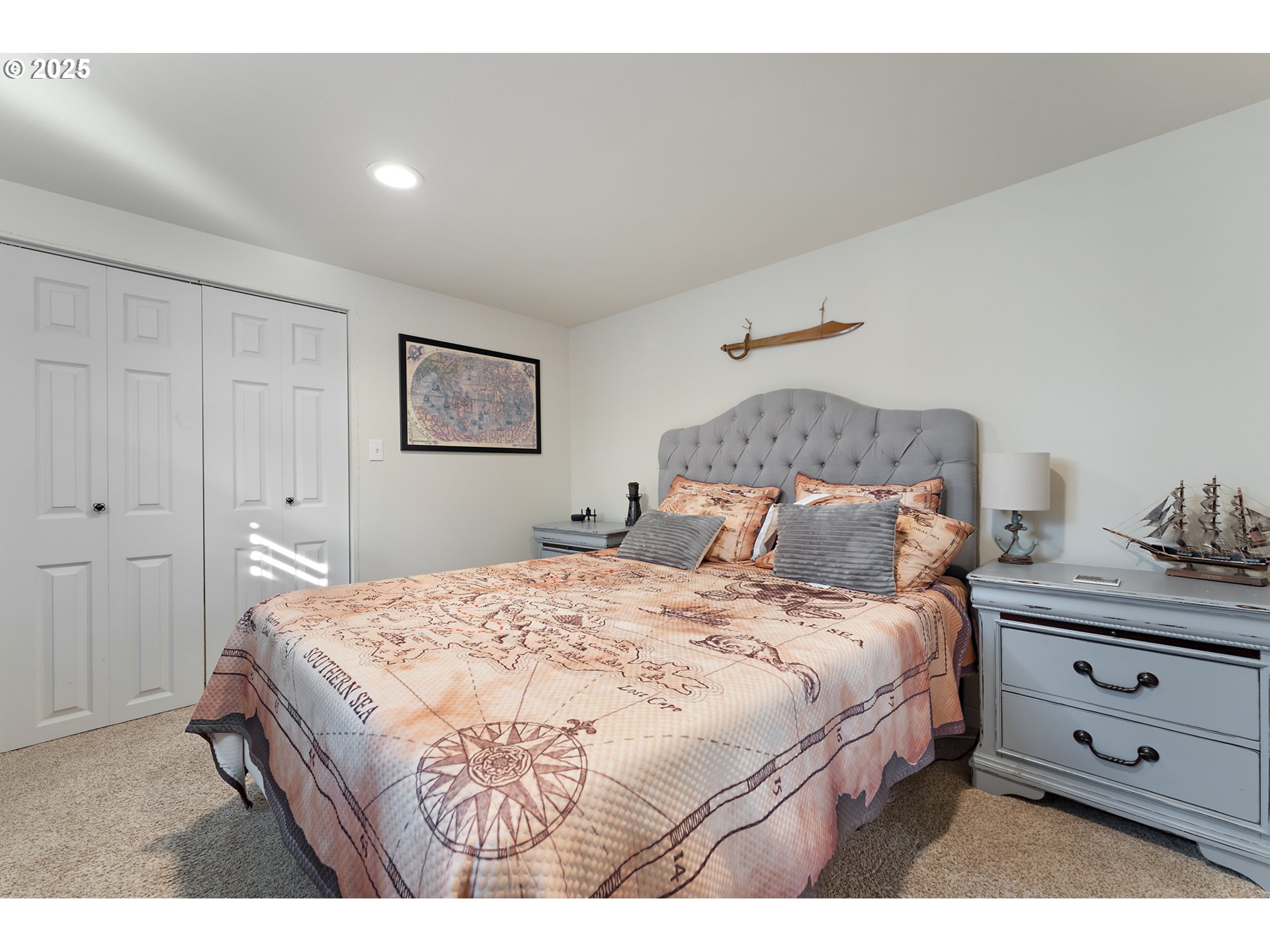 9670 Southwest Frewing Street Portland, OR 97223 - Photo 26 of 40 a bedroom with a bed and a night stand