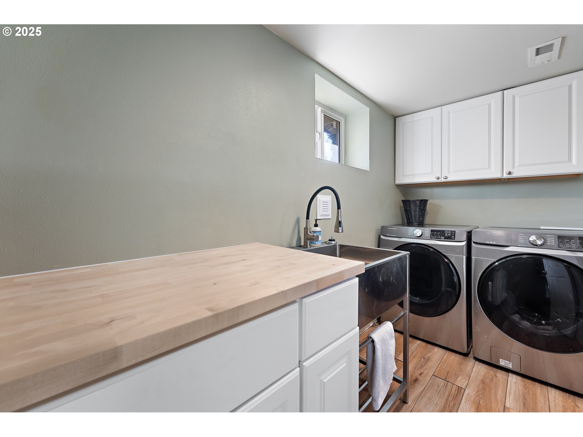 9670 Southwest Frewing Street Portland, OR 97223 - Photo 28 of 40 a kitchen with a sink a stove and cabinets